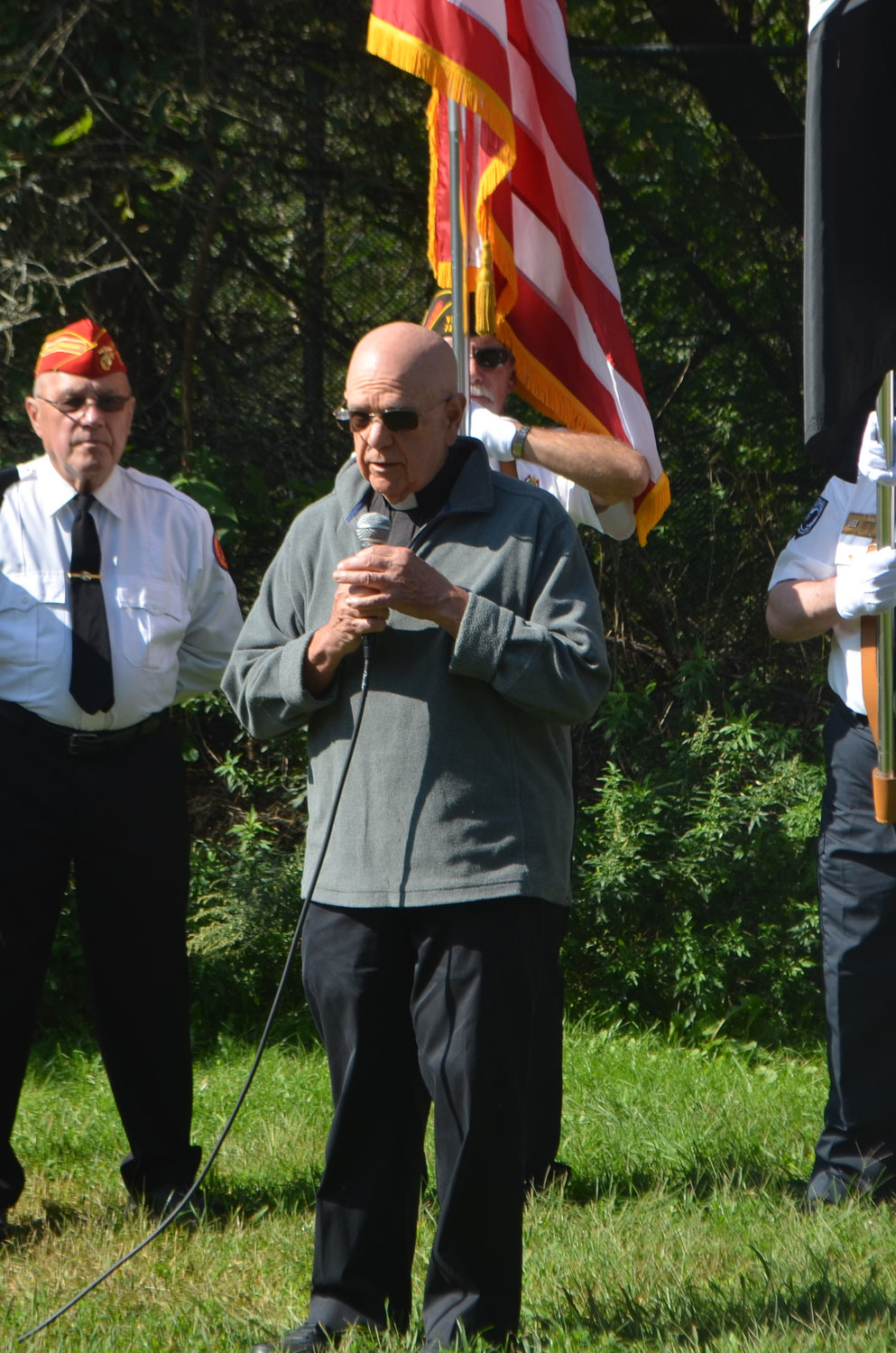 Pastor Bruce Anspach gives a closing prayer at the Town of Delaware September 11 memorial.